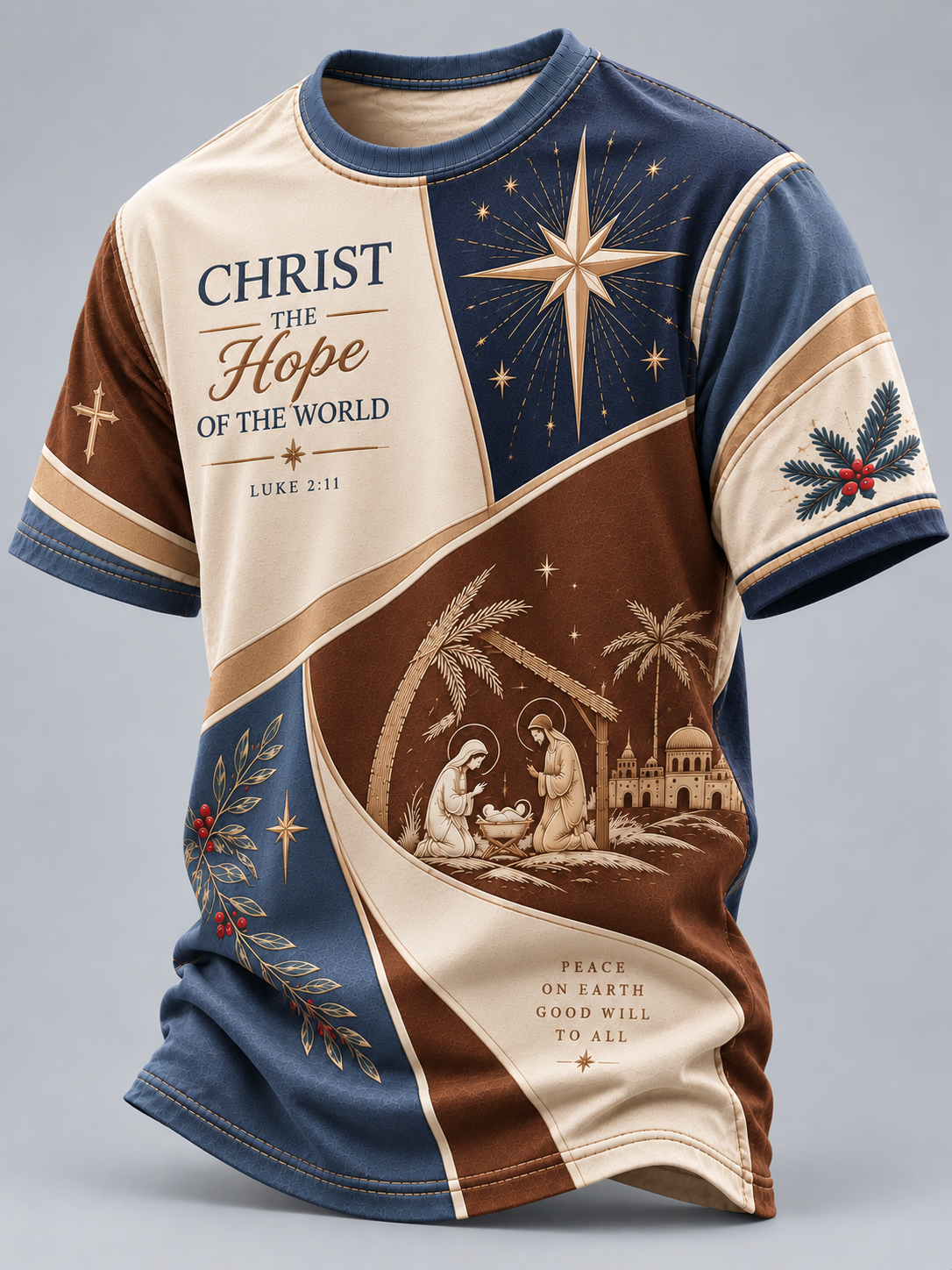 A short-sleeve crewneck t-shirt featuring a detailed Christmas graphic print. The design is split into navy blue, beige, and brown sections, with illustrations of a star, the Holy Family, and nativity scenes, along with the text 'CHRIST THE Hope OF THE WORLD' and 'LUKE 2:11'.