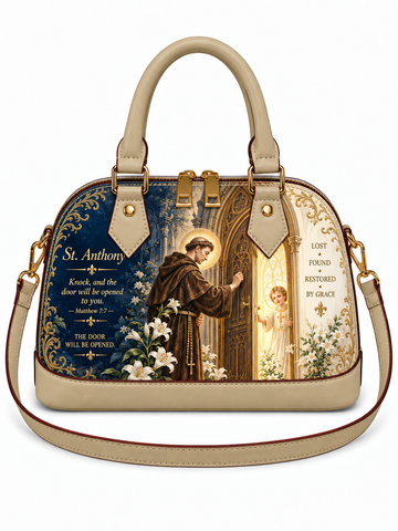 A structured dome-shaped handbag with beige leather trim and handles, featuring a detailed St. Anthony religious illustration on the front panel with gold-tone hardware and a matching shoulder strap.