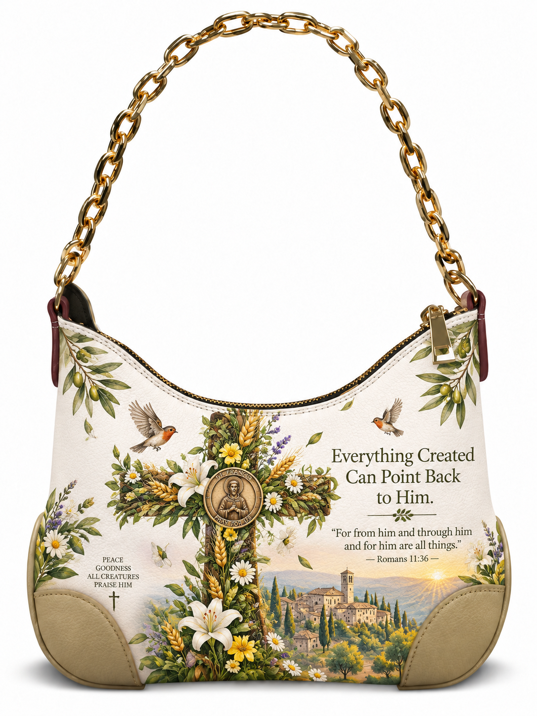A cream-colored shoulder bag with a gold chain strap, decorated with a large central cross, white lilies, birds, a scenic landscape, and Bible verses on a white background.