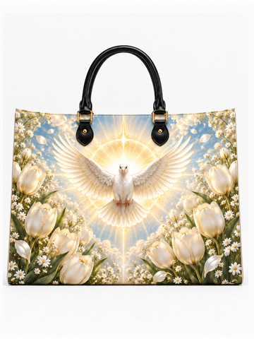 A structured tote bag with black leather handles and gold-tone hardware, featuring a detailed graphic print of a white dove with outstretched wings surrounded by a radiant halo and white tulips on a light blue sky background.