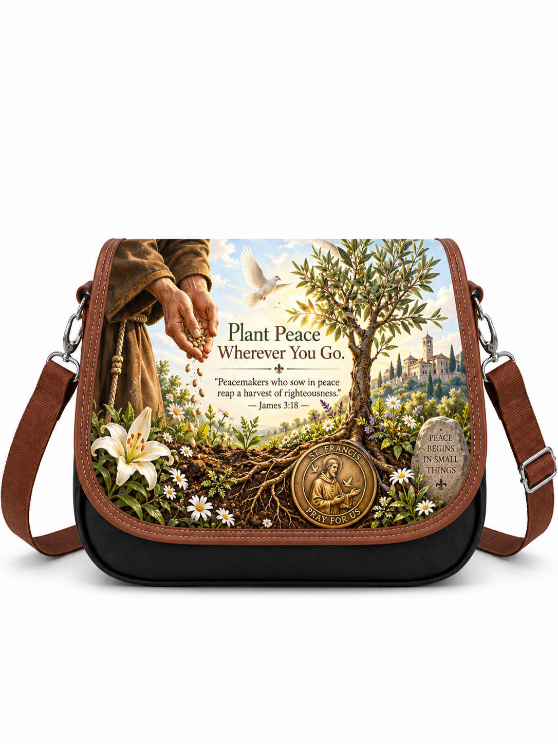 A black and brown crossbody bag featuring a detailed religious graphic print on the front. The print shows a hand planting an olive tree with the text 'Plant Peace Wherever You Go' and a Bible verse, alongside a gold-toned medallion and a small tombstone.
