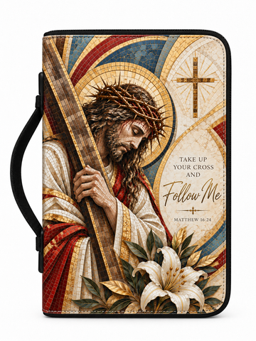 A zippered Bible or book cover featuring a detailed religious illustration of Jesus carrying a cross, with a crown of thorns, white lilies, and the text 'Take Up Your Cross and Follow Me' along with 'Matthew 16:24'. The cover has a black handle and black border on a white background.