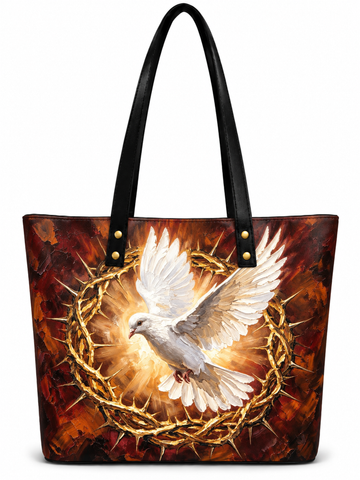 A tote bag with black shoulder straps, featuring a printed graphic of a white dove in flight surrounded by a crown of thorns against a fiery red and brown background.