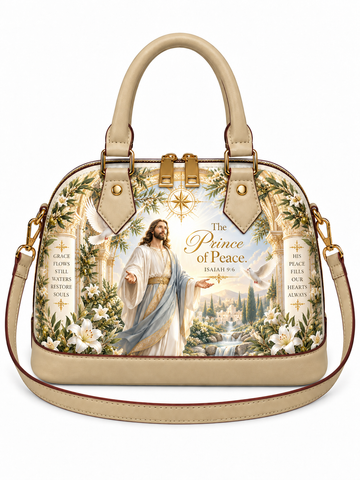 A structured dome-shaped handbag with beige leather handles and trim, featuring a detailed religious illustration of Jesus Christ with the text 'The Prince of Peace' and floral arch designs on the front, shown on a plain white background.