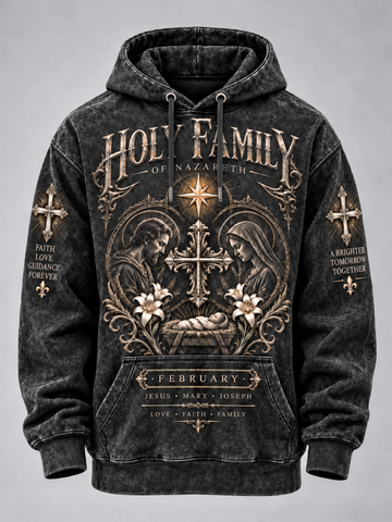 A dark gray acid-wash pullover hoodie featuring a detailed gothic-style graphic print on the front with 'Holy Family of Nazareth' text, a central cross, Mary, Joseph, and baby Jesus, floral accents, and scripture text on the sleeves and pocket.