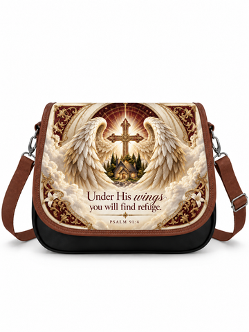A messenger bag with a brown leather trim and strap, featuring a large front graphic print of an angel with wings, a cross, a small church, and the text 'Under His wings you will find refuge. PSALM 91:4'.