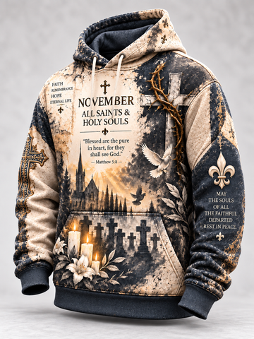 A hooded sweatshirt with a distressed, vintage-style print featuring the text 'NOVEMBER ALL SAINTS & HOLY SOULS,' a Bible verse, crosses, candles, flowers, and religious imagery. The hoodie is shown on a neutral gray background.