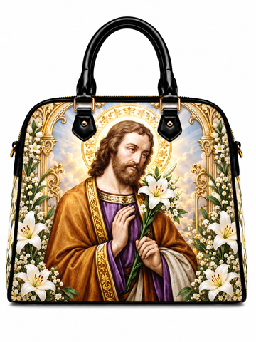 A structured black handbag with dual top handles, featuring a large printed religious design of Saint Christopher on the front, surrounded by white lilies and gold decorative borders.