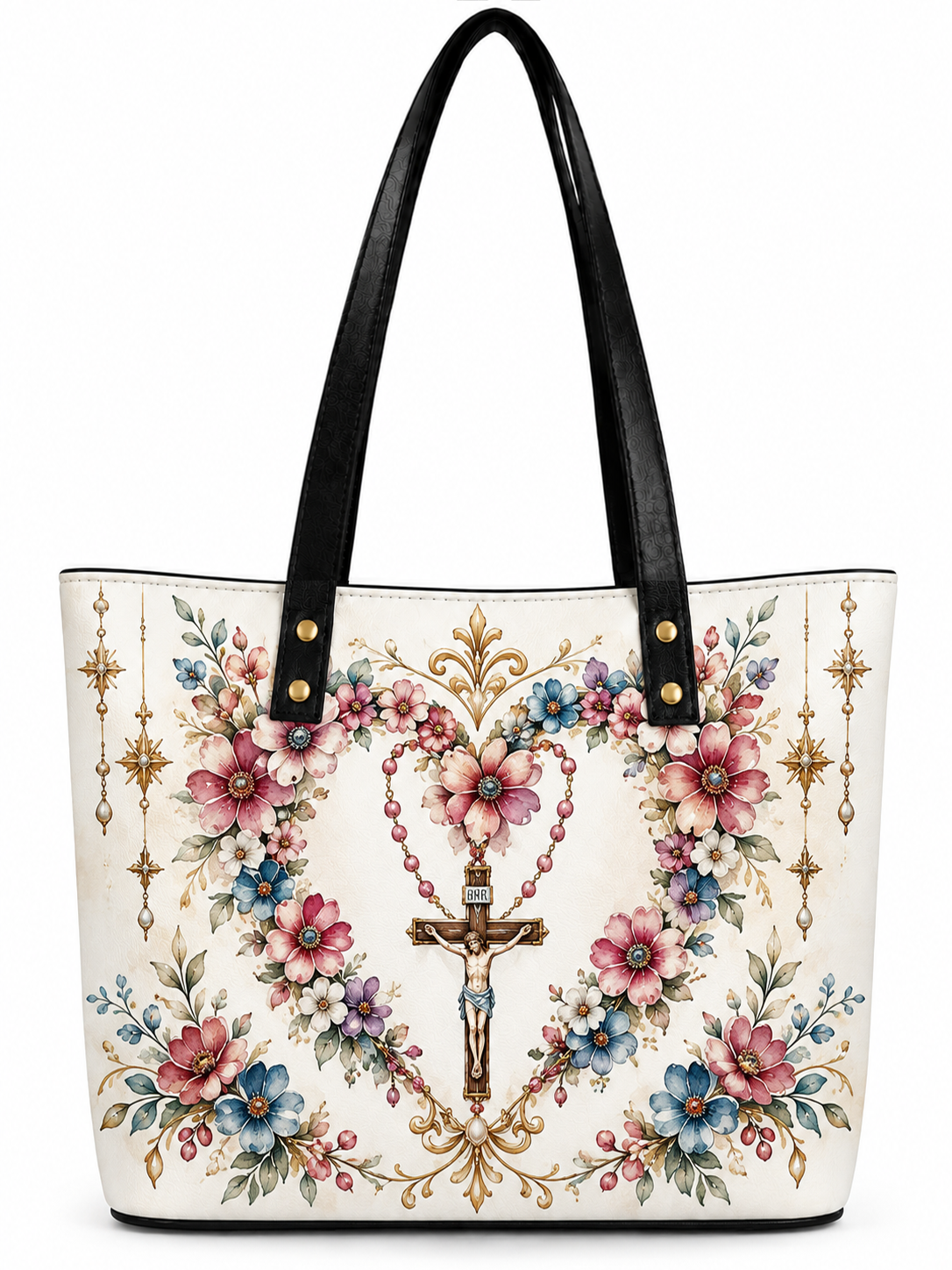 A white tote bag with black faux-leather shoulder straps, decorated with a detailed religious floral print featuring a central crucifix, rosary beads, pink and blue flowers, and gold ornamental details.