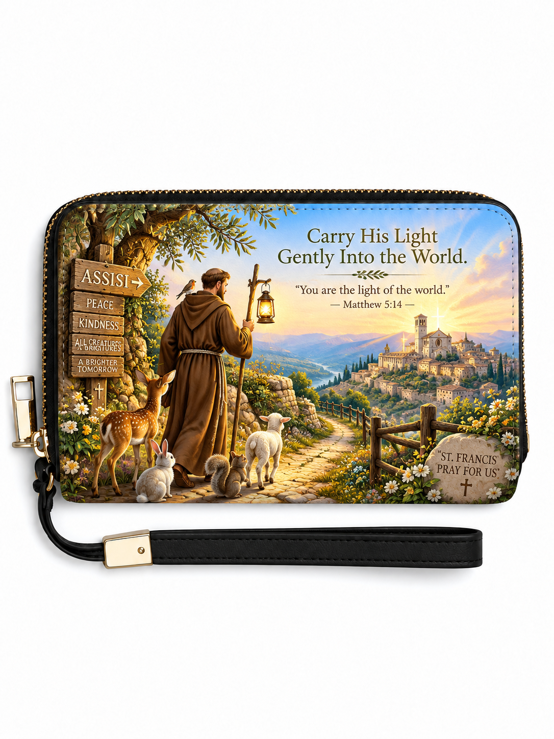 A rectangular zip-around wristlet wallet with a black wrist strap, featuring a colorful printed illustration of Saint Francis of Assisi with deer, a shepherd, a signpost, and a scenic landscape. The text on the design reads, 'Carry His Light Gently Into the World.
