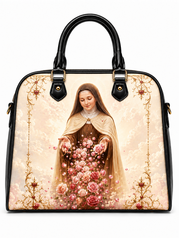 A structured black handbag with a large printed religious artwork on the front, showing a robed woman surrounded by pink and red flowers, with ornate gold decorative borders. The bag has black handles and gold-tone hardware, photographed on a plain white background.
