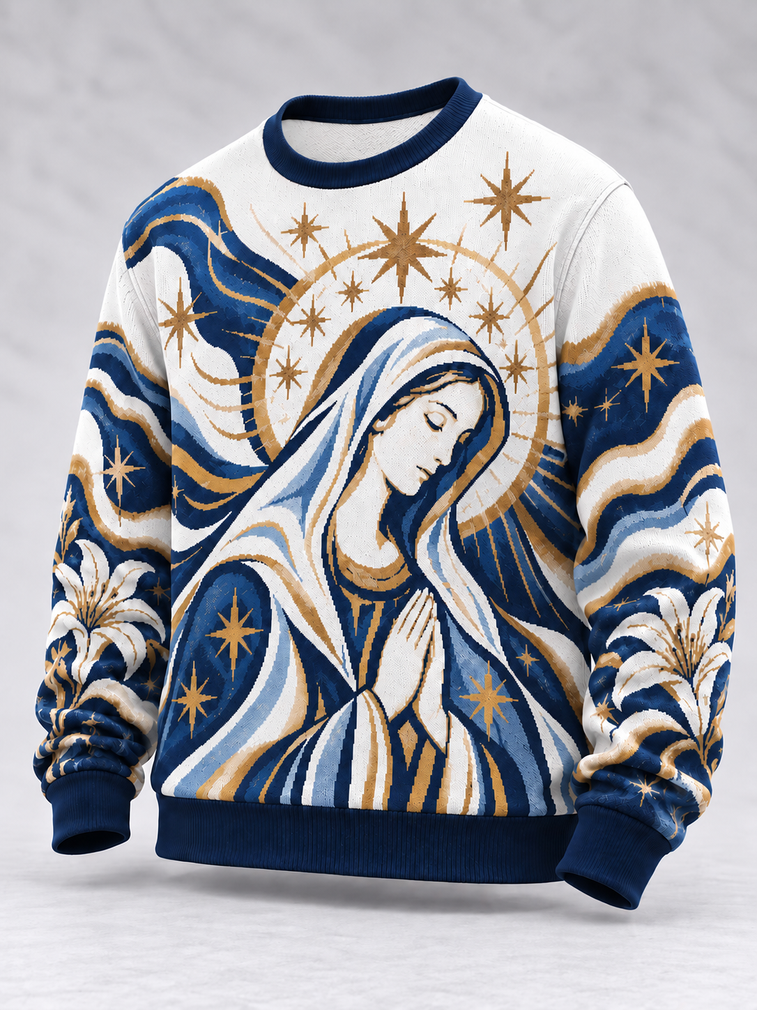 A long-sleeve crewneck sweatshirt featuring a detailed graphic print of the Virgin Mary with a gold halo, praying, surrounded by blue and white wavy patterns and gold stars. The sweatshirt has a white base with navy blue ribbed collar, cuffs, and hem.