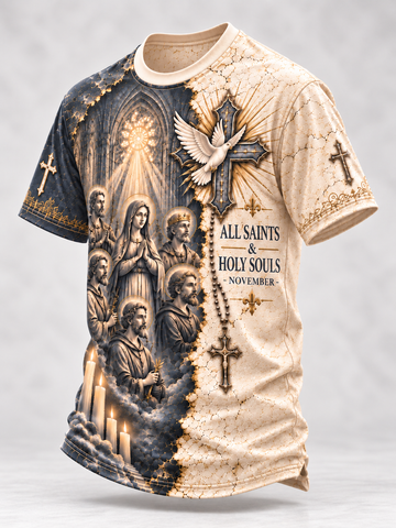 A short-sleeve crewneck t-shirt with a split design: one side is dark blue-gray with a gothic cathedral scene, rosary, candles, and a dove, while the other side is beige with a distressed texture and the text 'ALL SAINTS & HOLY SOULS - NOVEMBER'.