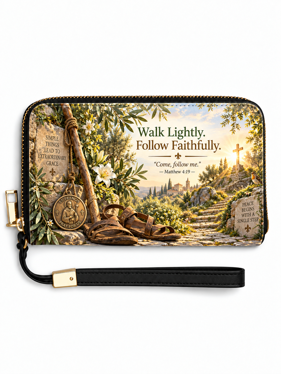 A zip-around wallet with a wrist strap, featuring a scenic religious illustration of a path toward a cross, sandals, a medal, and text reading 'Walk Lightly. Follow Faithfully.
