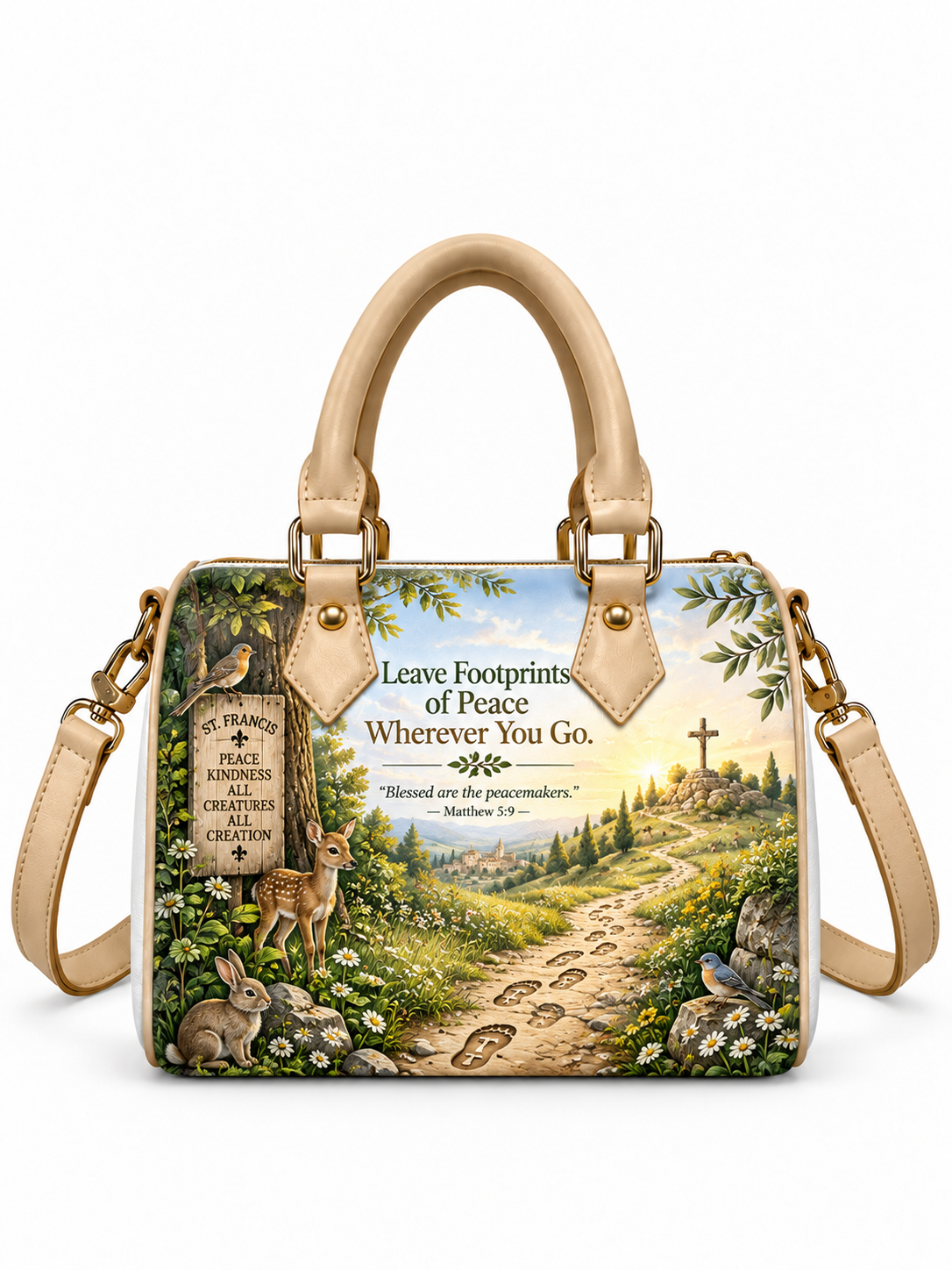 A structured beige handbag with a detailed nature scene printed on the front, featuring a path with footprints, a deer, a rabbit, birds, and a cross under a sign reading 'Leave Footprints of Peace Wherever You Go' with a Bible verse. It has beige leather handles and a matching shoulder strap with gold-tone hardware.