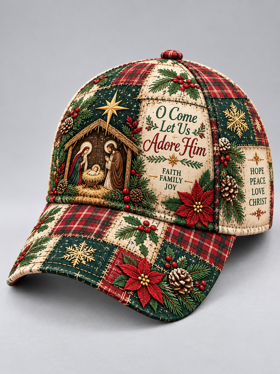 A Christmas-themed baseball cap featuring a patchwork design with red and green plaid, green pine trees, red poinsettias, snowflakes, and a nativity scene. The front panel includes the text 'O Come Let Us Adore Him' and 'Faith Family Joy'.