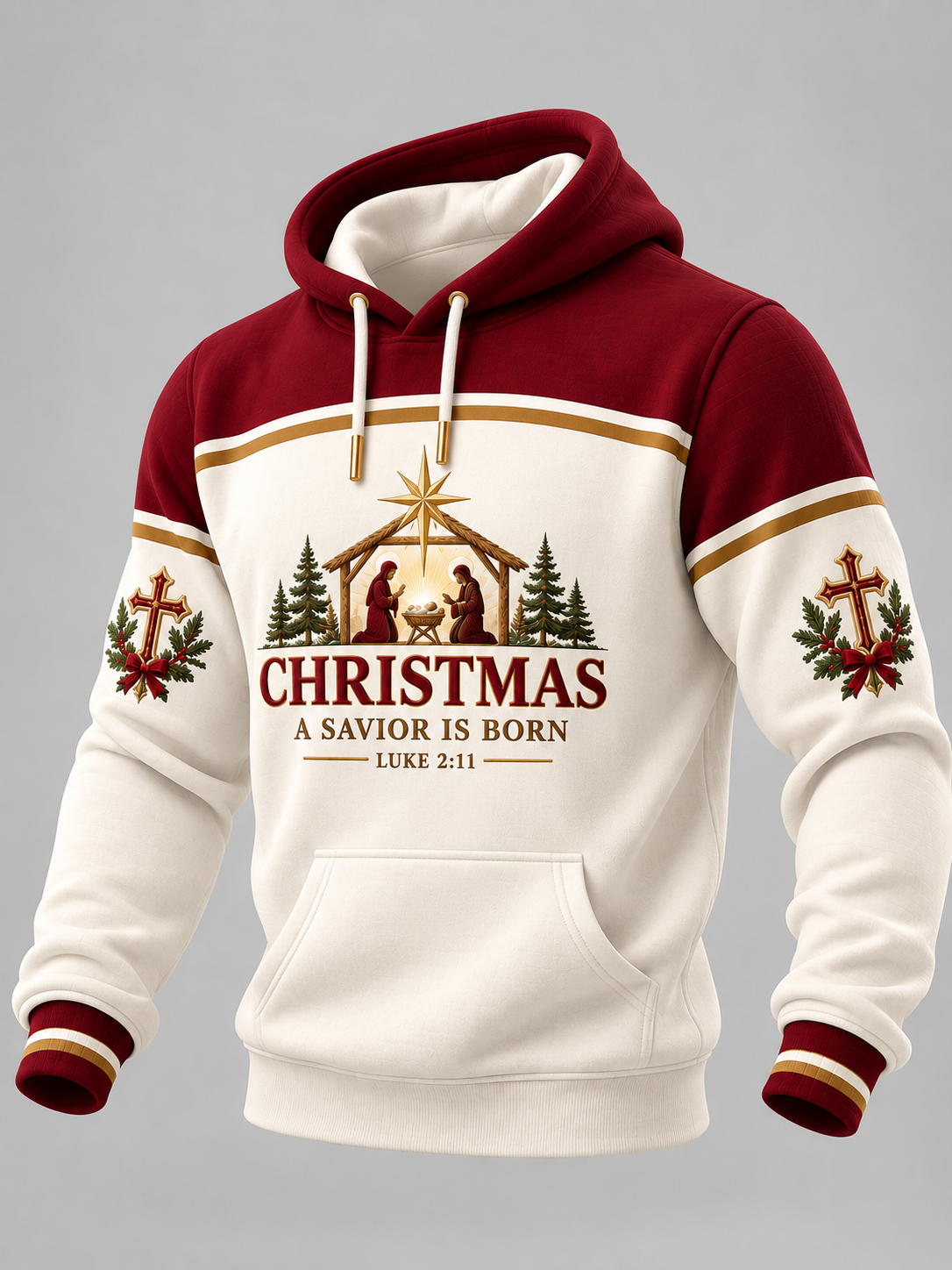 A Christmas-themed pullover hoodie with a maroon and cream color-blocked design, featuring a nativity graphic and the text 'CHRISTMAS A SAVIOR IS BORN' on the front, with matching holiday prints on the sleeves.