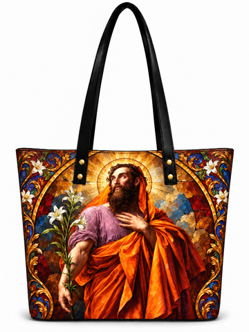 A black leather-look tote bag with a large, colorful religious art print featuring Saint Christopher on the front, set against a plain white background.