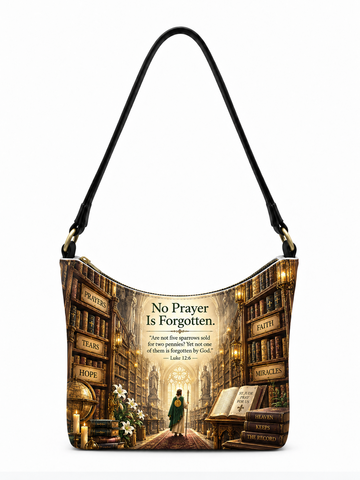 A shoulder bag with a black strap, featuring a printed design of a library aisle with books, candles, and a central figure. The text on the bag reads 'No Prayer Is Forgotten' with a Bible verse and words like 'PRAY', 'FEEL', 'TEARS', 'HOPE', 'FAITH', and 'MIRACLES' printed on the bookshelves.