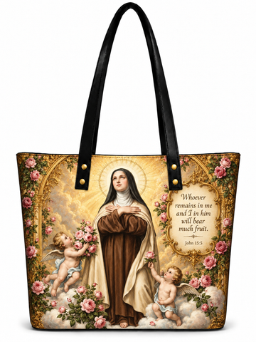 A tote bag featuring a detailed religious print of Our Lady of Fatima with cherubs and pink roses, complete with black shoulder straps and gold hardware, set against a plain white background.
