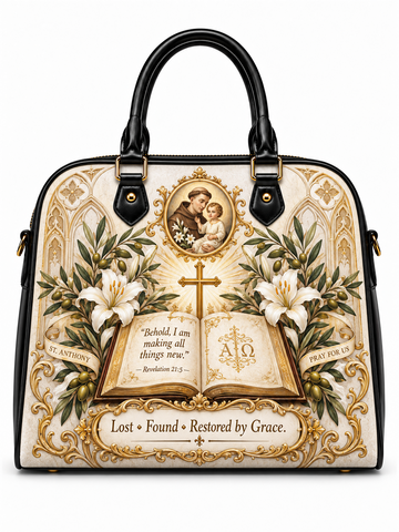A structured black and cream handbag with ornate gold religious artwork, including a cross, open Bible, lilies, and a saint portrait medallion, shown on a plain white background.
