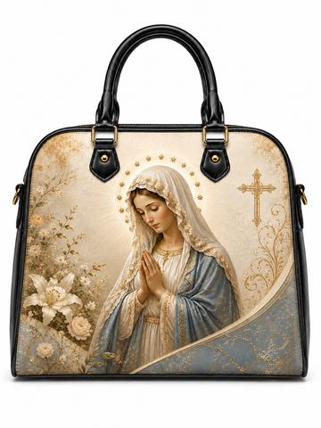A structured black handbag with a large printed religious illustration of the Virgin Mary on the front, featuring gold floral details, a gold cross, and a cream background.