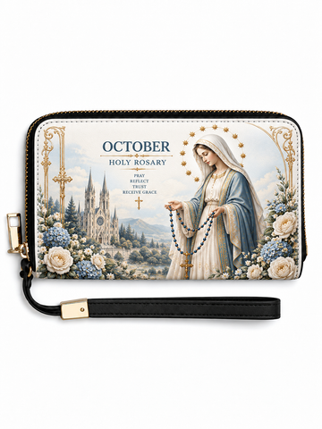 A zip-around wallet with a black wrist strap, featuring a printed Holy Rosary design with a depiction of the Virgin Mary, flowers, a cathedral, and the text 'OCTOBER HOLY ROSARY' on a white background.
