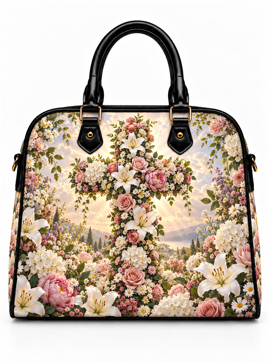 A structured handbag with black leather handles and trim, featuring a detailed floral and landscape print on the body. The design showcases a large cross made of pink and white flowers, surrounded by roses, lilies, and wildflowers over a scenic background.