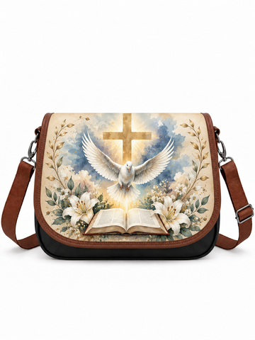 A messenger-style shoulder bag with a brown leather strap and trim, featuring a large printed religious design on the front flap. The artwork shows a white dove flying in front of a gold cross, with an open Bible and white flowers below, set against a cream sky background.