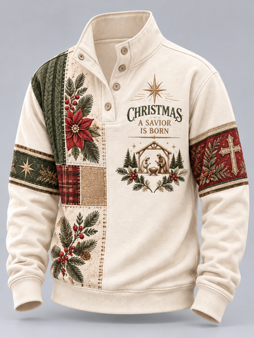 An off-white long-sleeve quarter-placket pullover sweater with a Christmas patchwork design, featuring a red poinsettia, green pine branches, a nativity scene, and the text 'CHRISTMAS A SAVIOR IS BORN' on the chest.