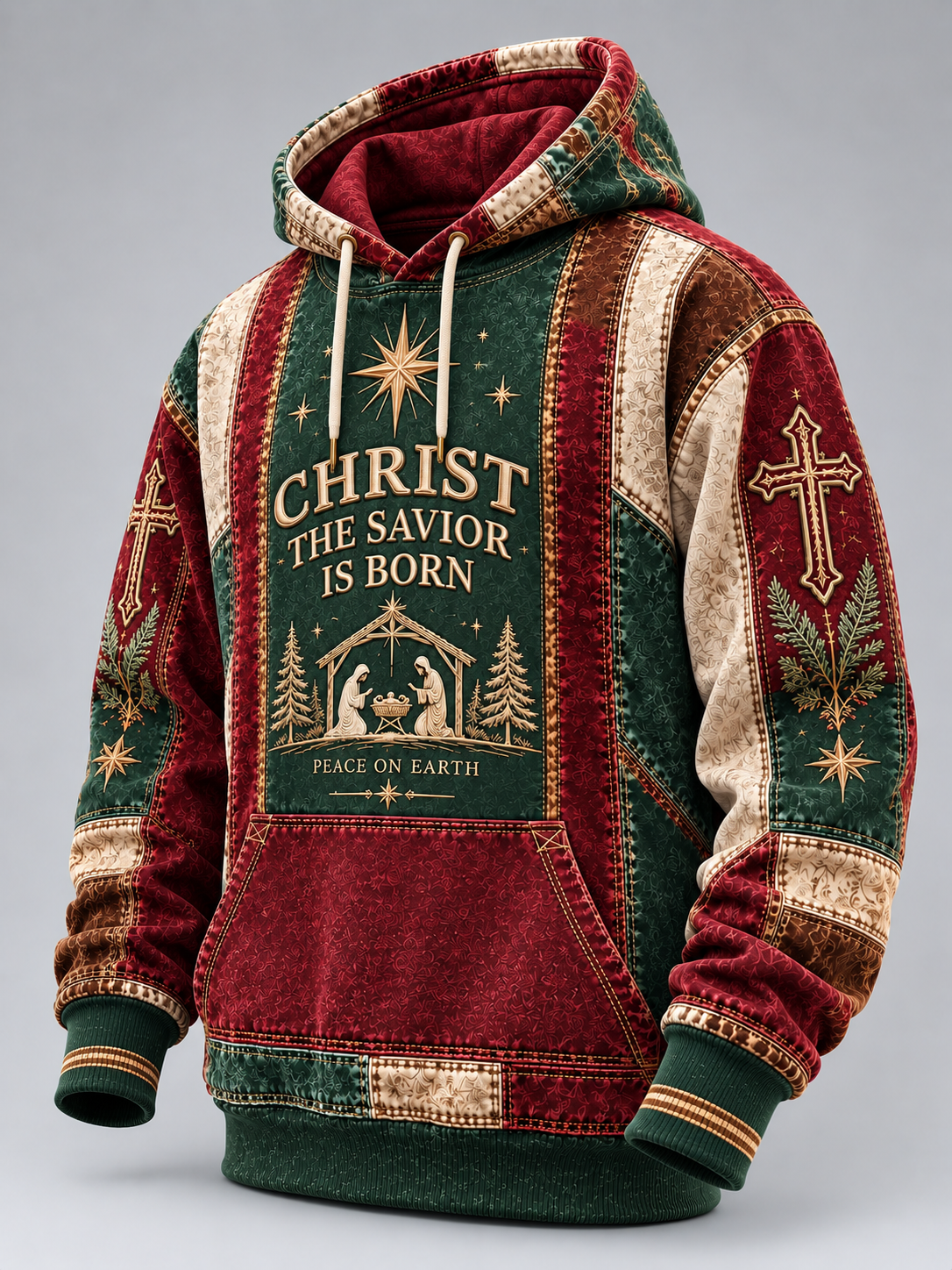 A Christmas-themed pullover hoodie with a red and green patchwork design, featuring a large front graphic that reads 'CHRIST THE SAVIOR IS BORN' with a nativity scene, and gold-toned cross and star motifs on the sleeves.
