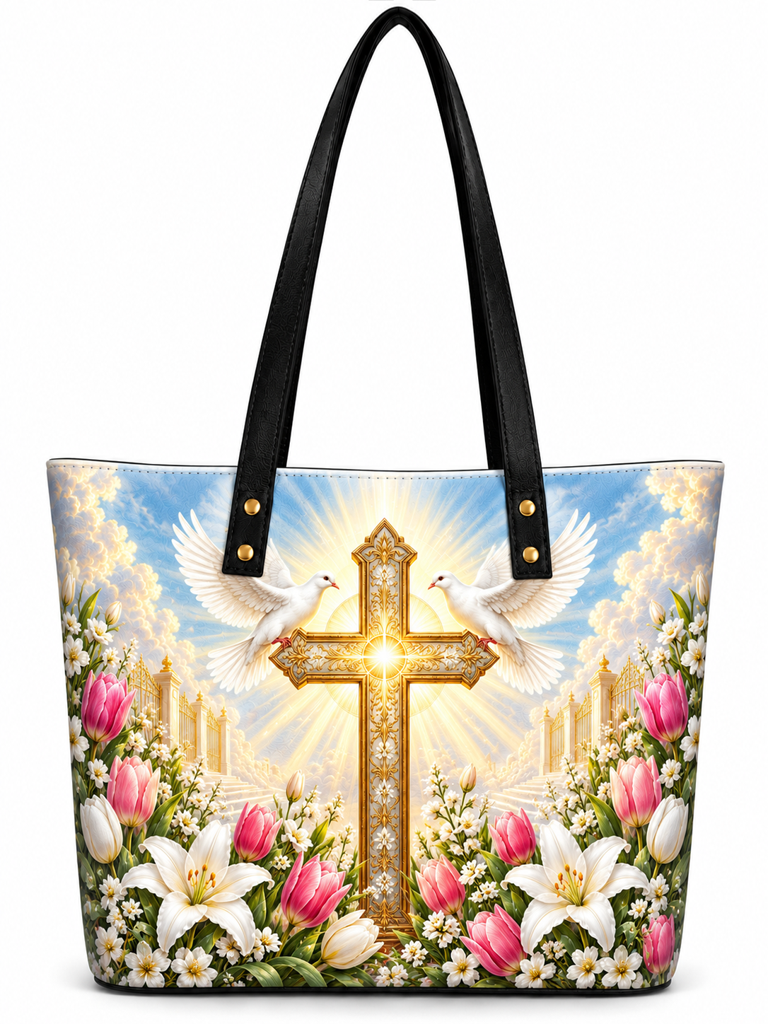 A tote bag with black handles, featuring a vibrant printed design of a golden cross, two white doves, pink and white lilies, and a bright sky background.