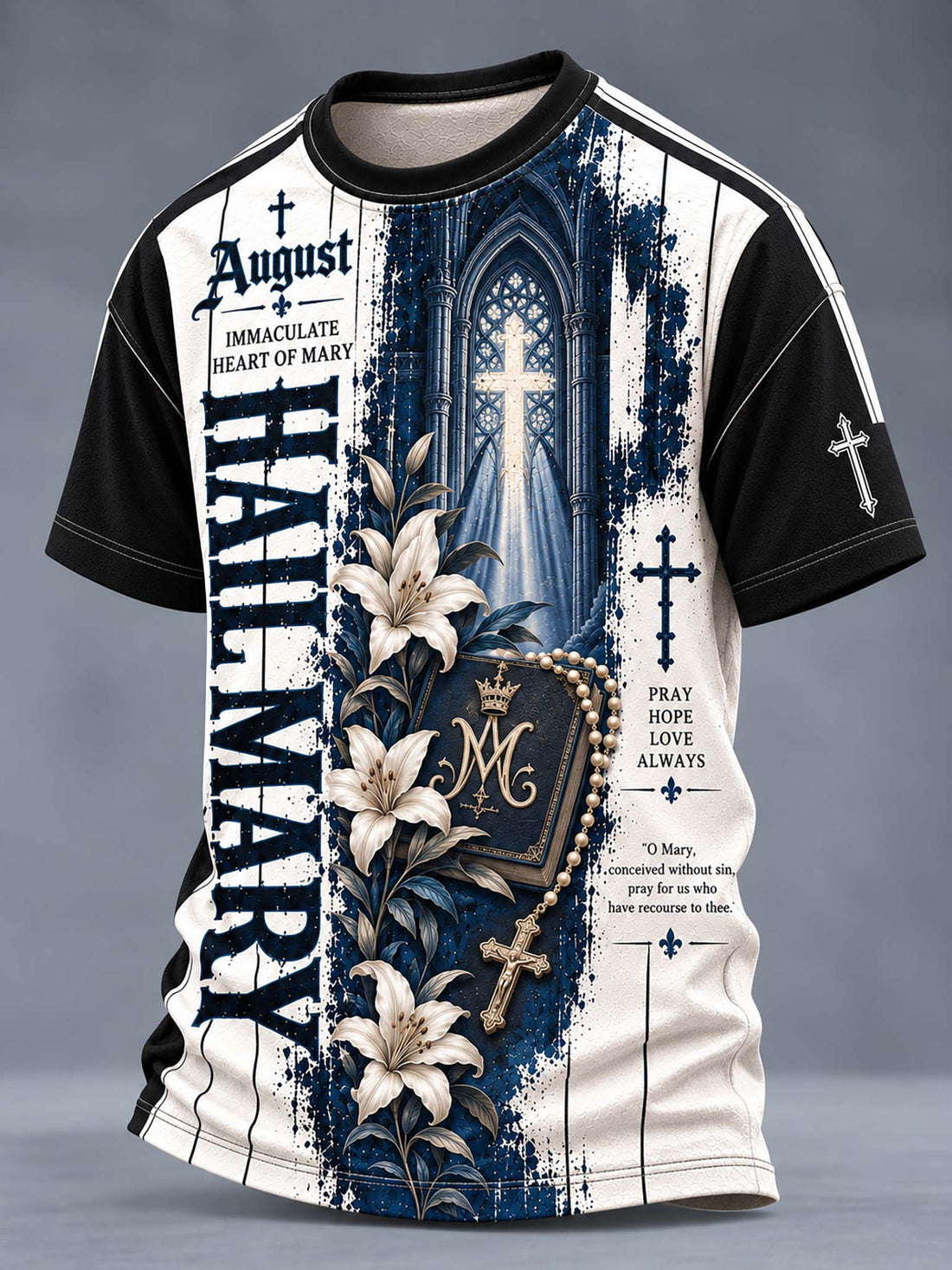 A short-sleeve crewneck t-shirt with a complex religious graphic print. The design features a split background of dark blue and off-white, with a gothic cathedral window, a rosary, white lilies, a monogrammed heart of Mary, and gothic typography including 'HAIL MARY' and 'August'.